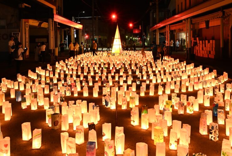 Rows of hand-painted paper lanterns glowing at night along Honmachi shopping street in Iiyama